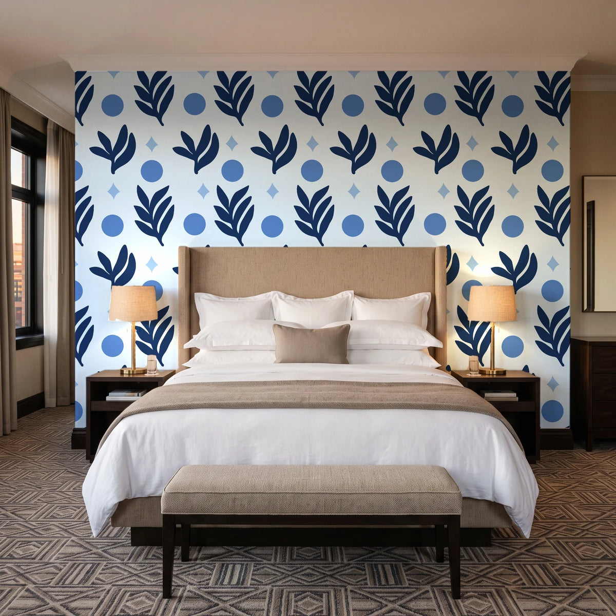 Spice & Frond Indigo leaf frond wallpaper behind the headboard of a king bed in a contemporary hotel guest room