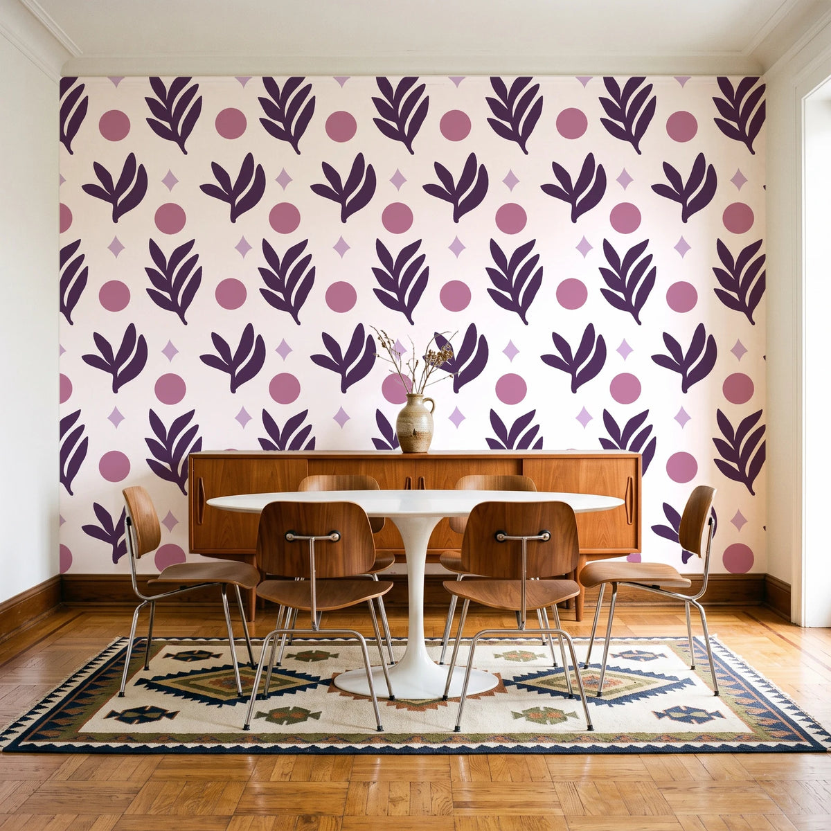 Spice & Frond Plum leaf frond wallpaper in a mid-century dining room with a teak sideboard and tulip table