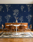 Star & Petal Midnight wildflower line art wallpaper in a mid-century dining room with a teak sideboard and tulip table