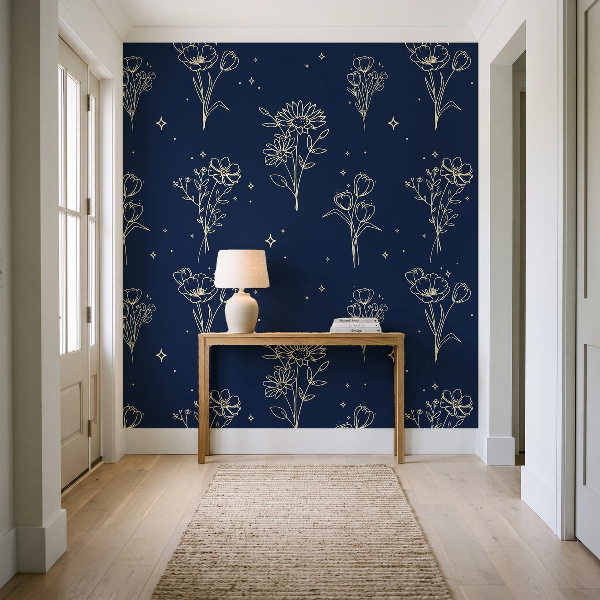 Star & Petal Midnight wildflower line art wallpaper behind a console table in a light entry hallway