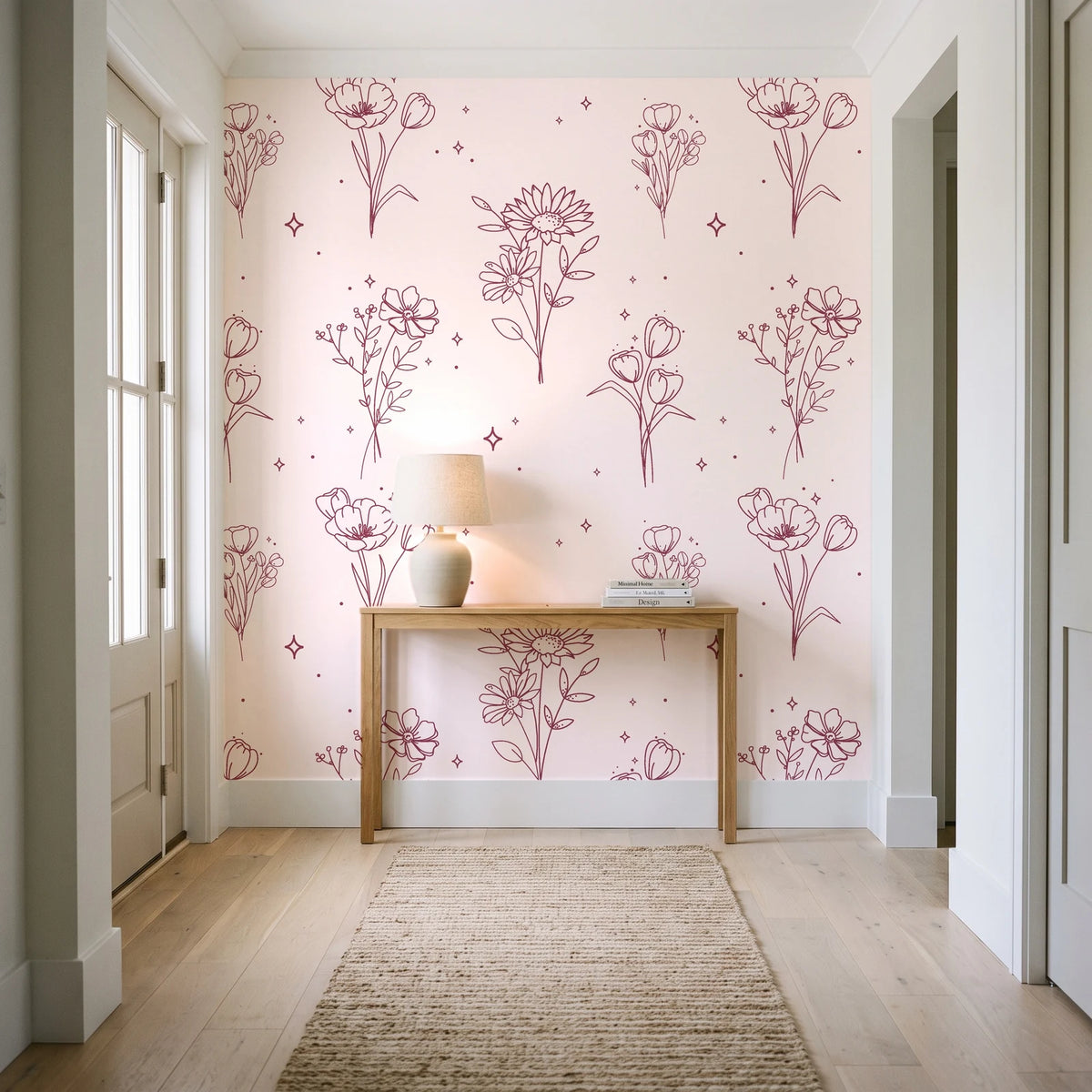 Star & Petal Rose wildflower line art wallpaper behind a console table in a light entry hallway
