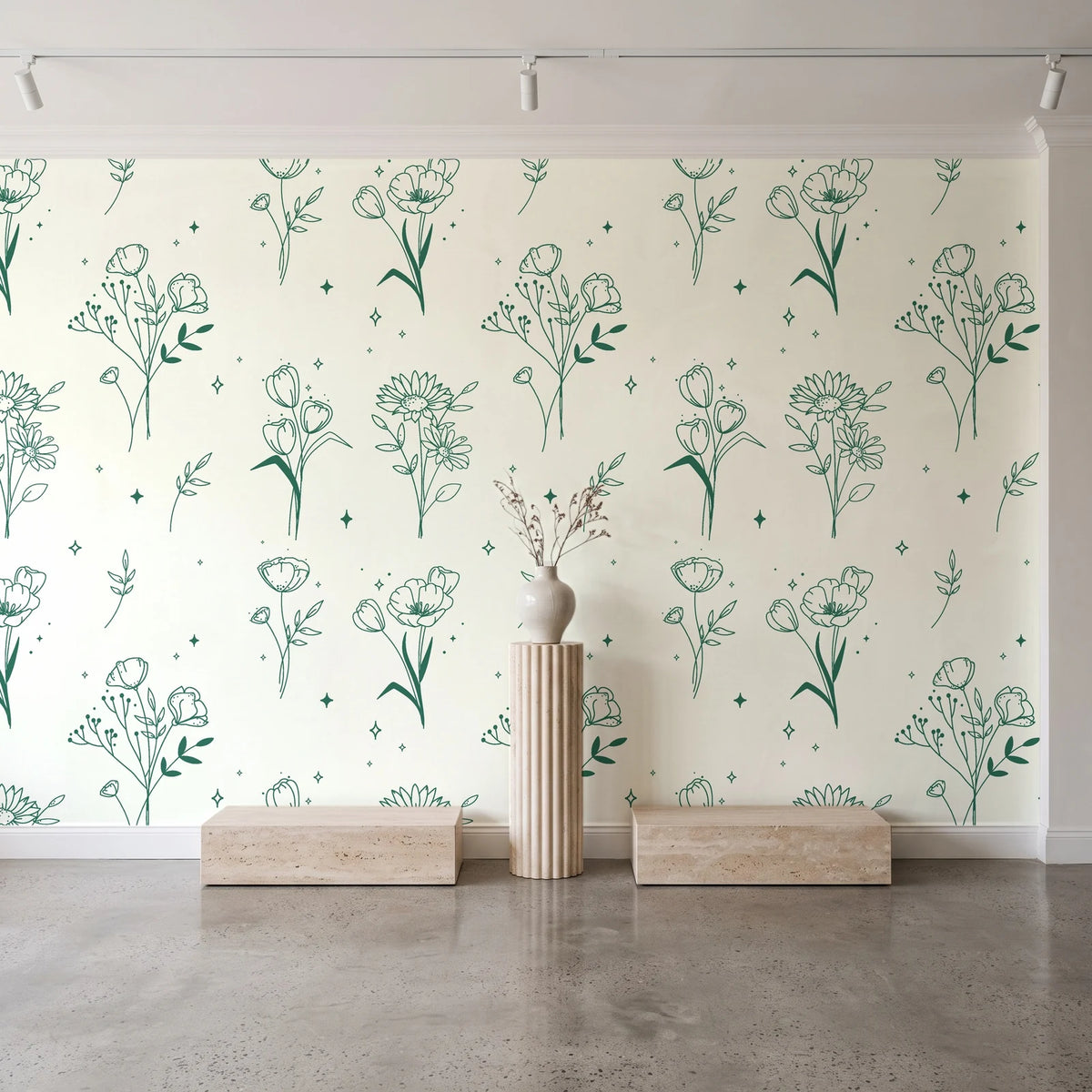 Stardust Field Emerald wildflower line art wallpaper behind a travertine pedestal and vase in a minimal boutique