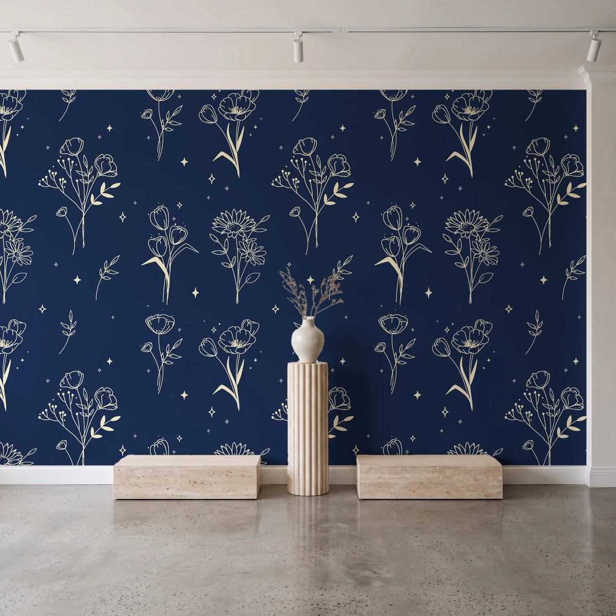 Stardust Field Midnight wildflower line art wallpaper behind a travertine pedestal and vase in a minimal boutique