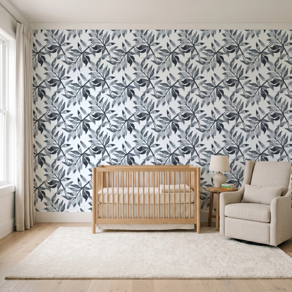 Starfall Charcoal watercolor leaf wallpaper in a calm, light-filled nursery