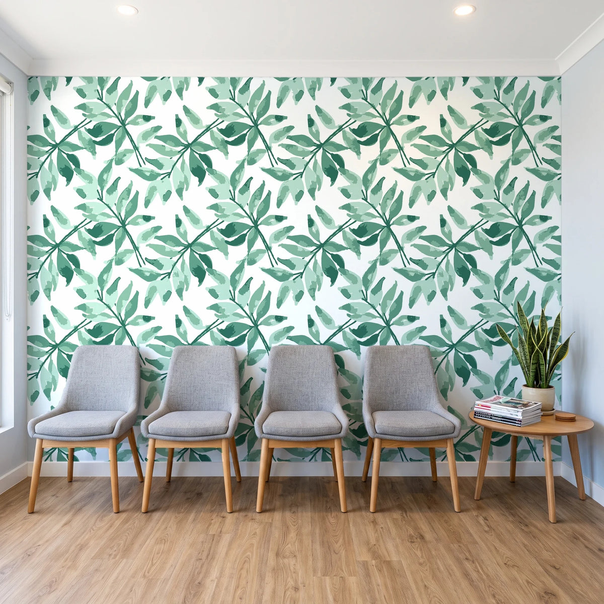 Starfall Emerald watercolor leaf wallpaper behind a row of upholstered chairs in a bright clinic waiting room