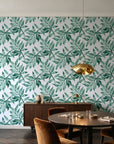 Starfall Emerald watercolor leaf wallpaper in an elegant dining room