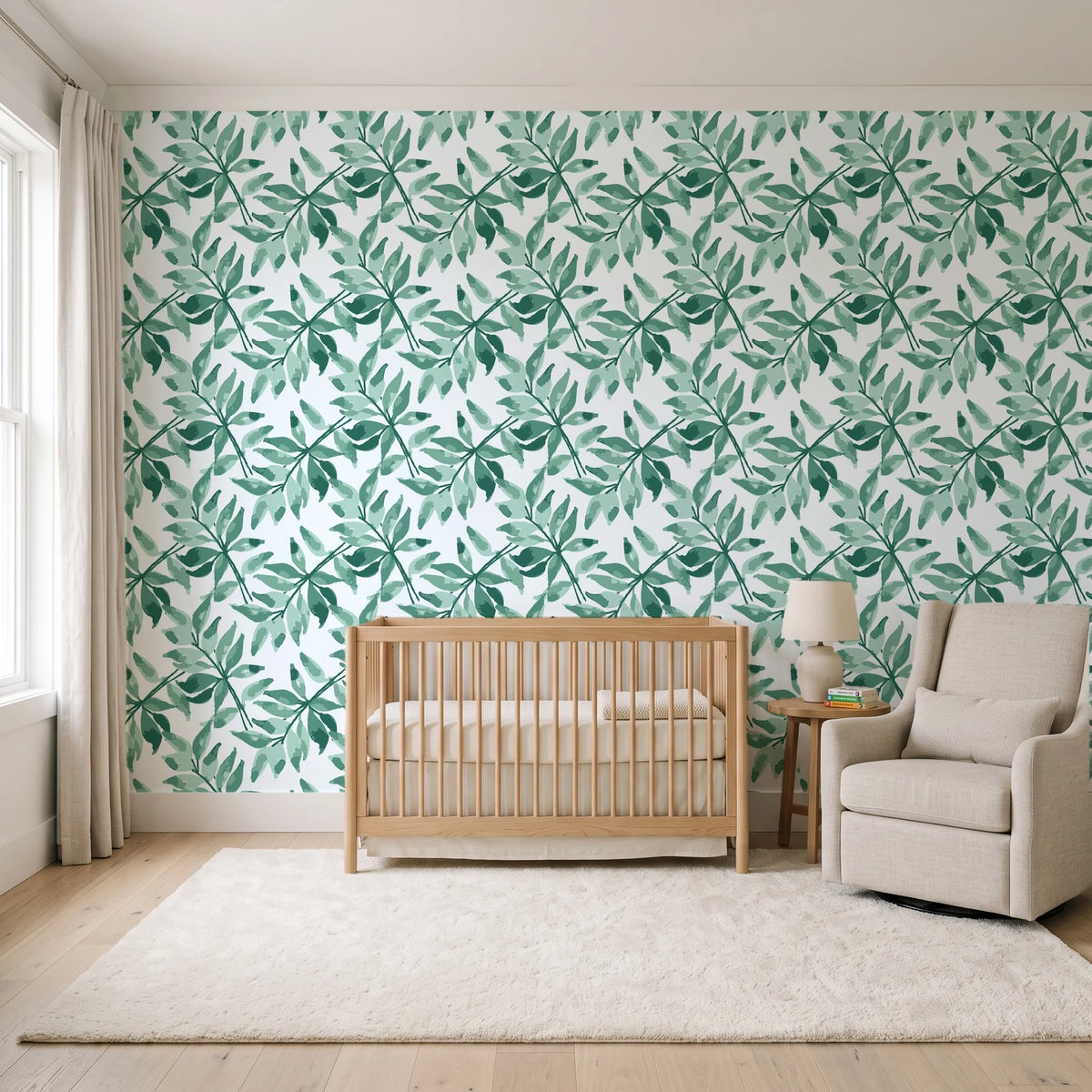 Starfall Emerald watercolor leaf wallpaper in a calm, light-filled nursery