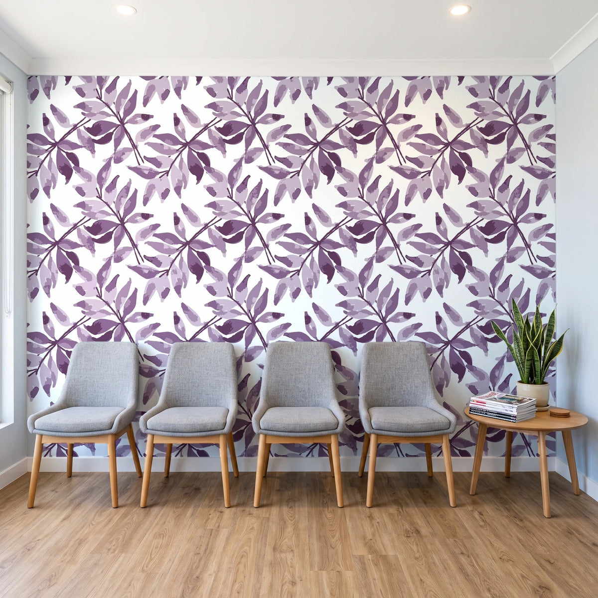 Starfall Plum watercolor leaf wallpaper behind a row of upholstered chairs in a bright clinic waiting room
