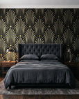 Starlit Swirl Onyx dotted art deco fan wallpaper behind a tufted headboard in a dark, moody bedroom