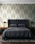 Starlit Swirl Pearl dotted art deco fan wallpaper behind a tufted headboard in a dark, moody bedroom