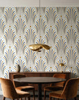 Starlit Swirl Pearl dotted art deco fan wallpaper behind a walnut credenza and round table in an elegant dining room