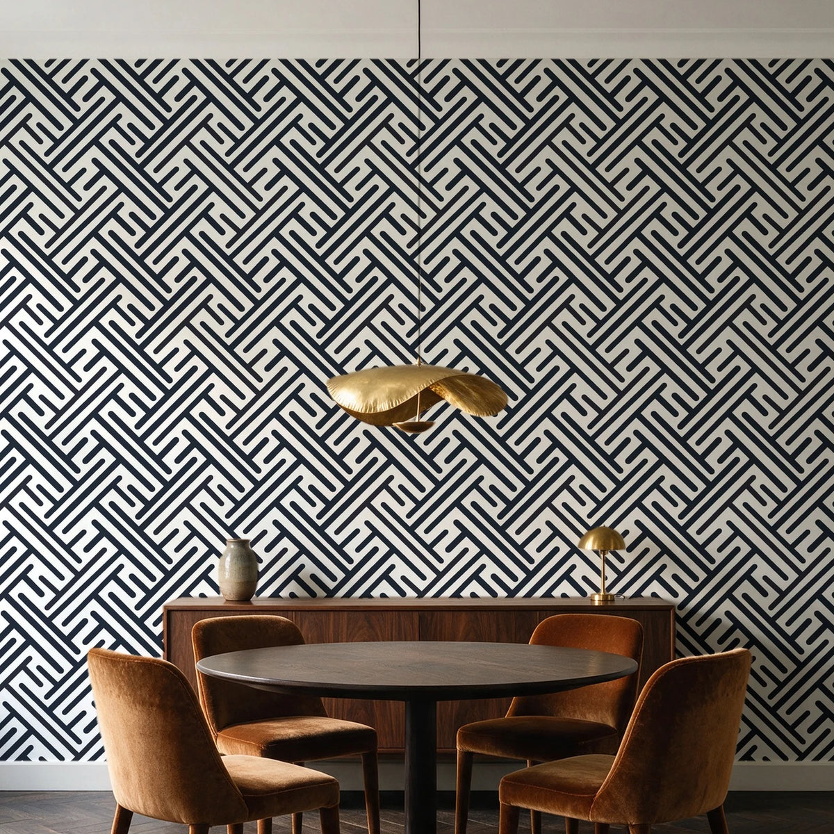 Still Labyrinth Ink maze geometric wallpaper behind a walnut credenza and round table in an elegant dining room