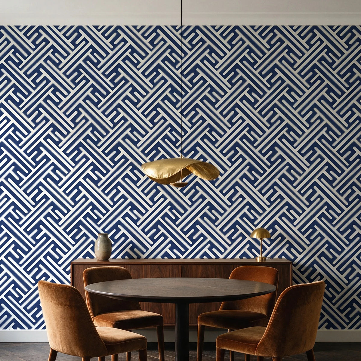 Still Labyrinth Navy maze geometric wallpaper behind a walnut credenza and round table in an elegant dining room