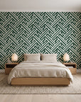 Still Labyrinth Pine maze geometric wallpaper behind a low platform bed in a serene Japandi bedroom