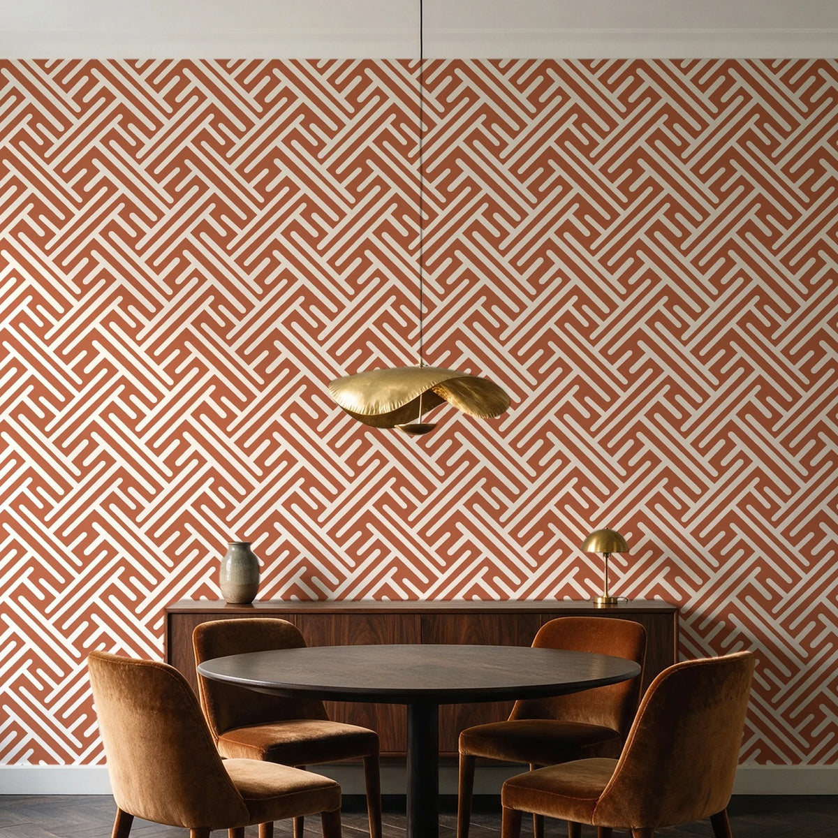 Still Labyrinth Terracotta maze geometric wallpaper behind a walnut credenza and round table in an elegant dining room