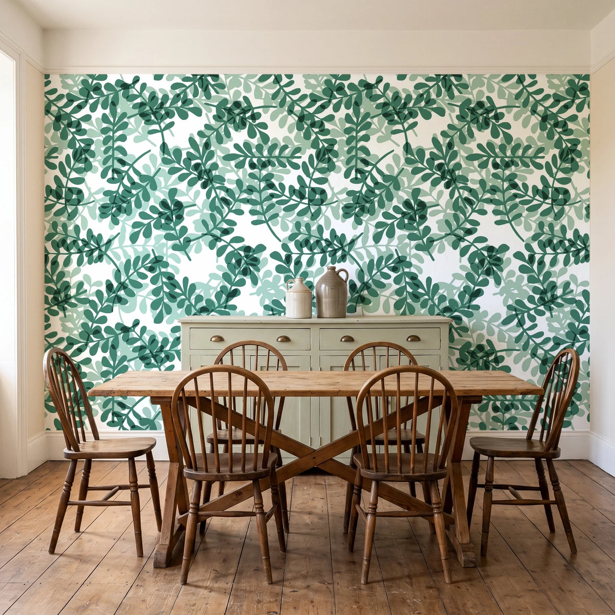 Still Morning Emerald foliage wallpaper in a farmhouse dining room with a sage sideboard and rustic trestle table