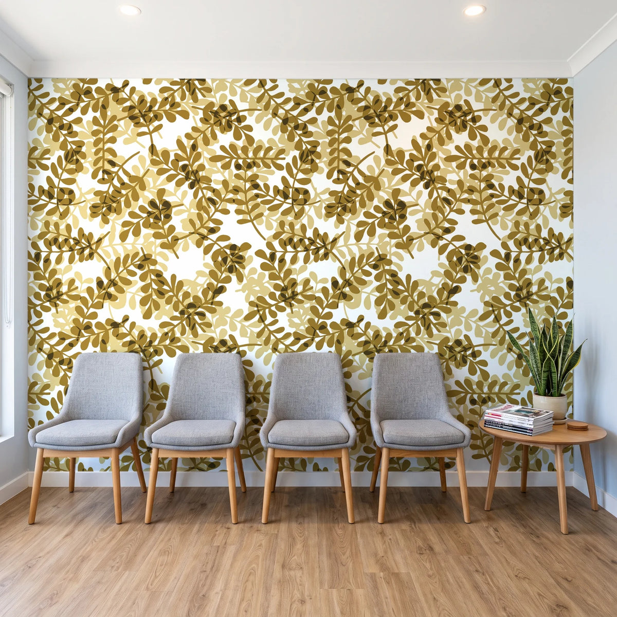 Still Morning Ochre foliage wallpaper behind a row of upholstered chairs in a bright clinic waiting room