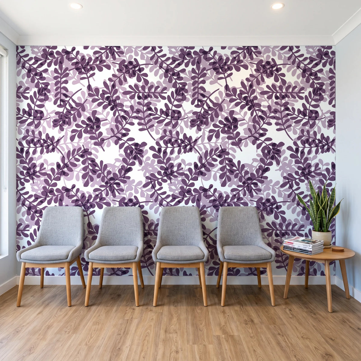 Still Morning Plum foliage wallpaper behind a row of upholstered chairs in a bright clinic waiting room