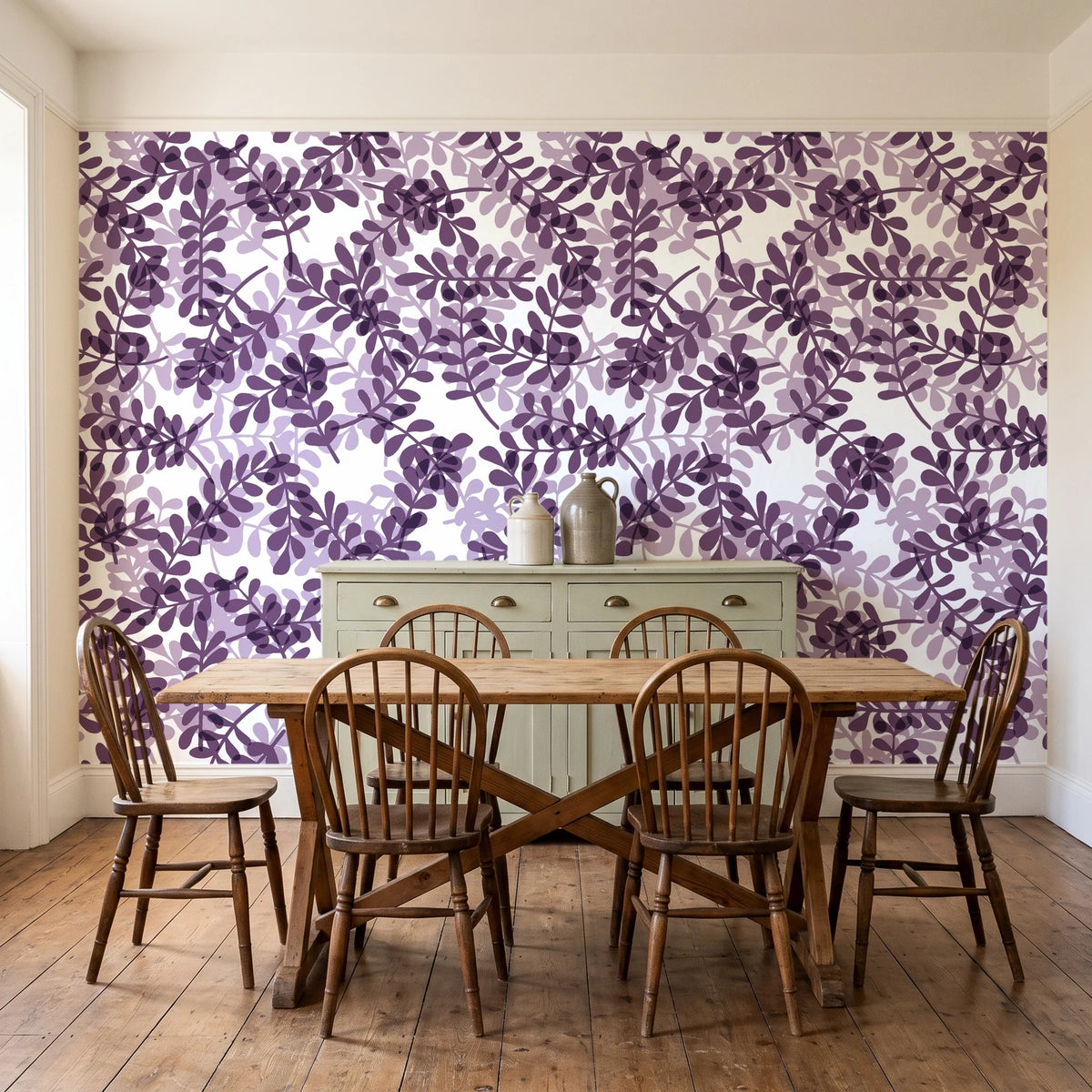 Still Morning Plum foliage wallpaper in a farmhouse dining room with a sage sideboard and rustic trestle table