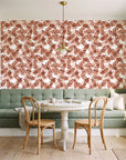 Still Morning Terracotta foliage wallpaper as a feature wall in a sunlit breakfast nook