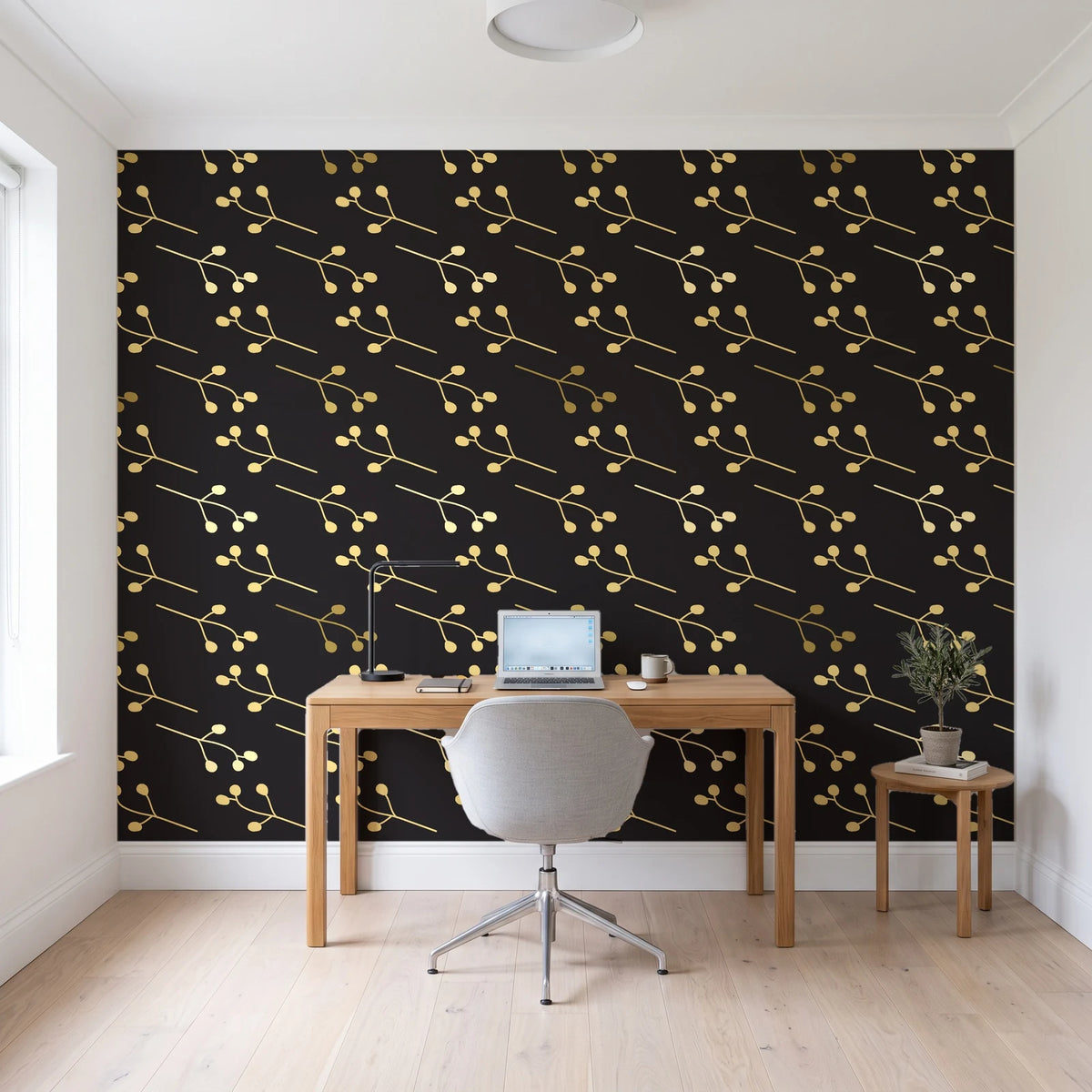 Stone Garden Noir sprig wallpaper behind a modern oak desk in a bright home office