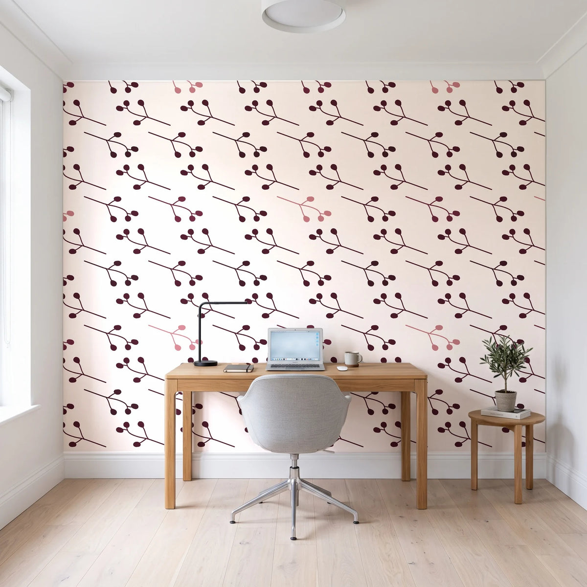 Stone Garden Oxblood sprig wallpaper behind a modern oak desk in a bright home office