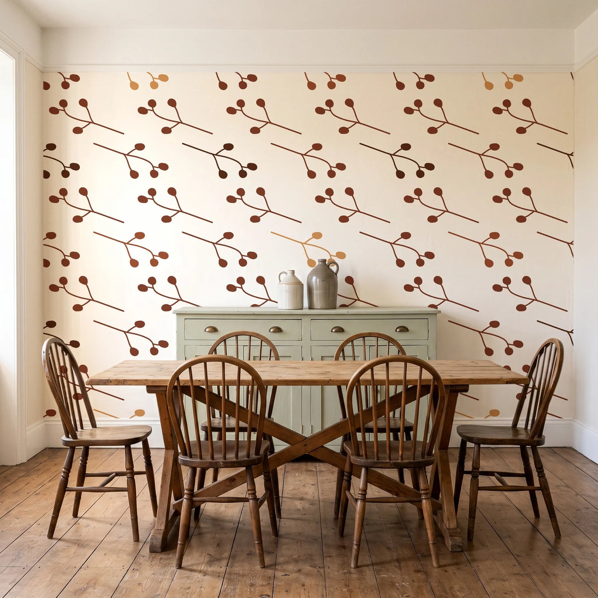 Stone Garden Terracotta sprig wallpaper in a farmhouse dining room with a sage sideboard and rustic trestle table