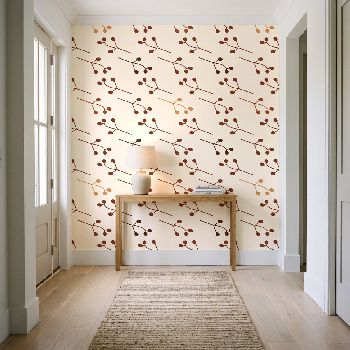 Stone Garden Terracotta sprig wallpaper behind a console table in a light entry hallway