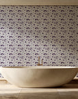 Sun & Moon Parchment celestial folk wallpaper creating ambiance in a serene spa bathroom