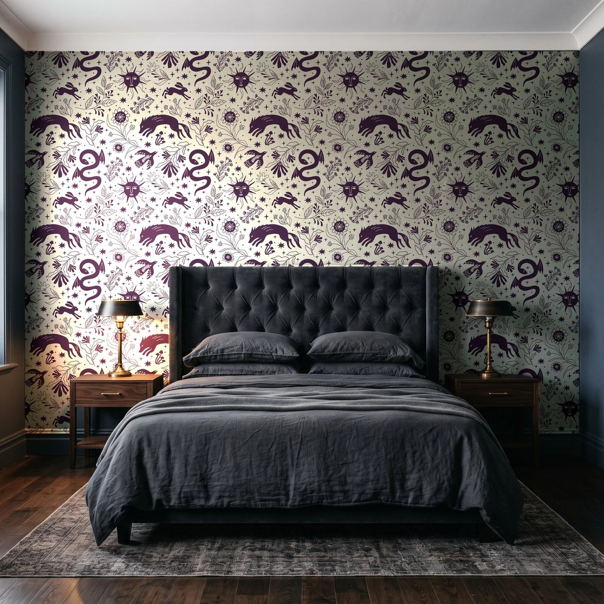 Sun & Moon Parchment celestial folk wallpaper behind a tufted headboard in a dark, moody bedroom
