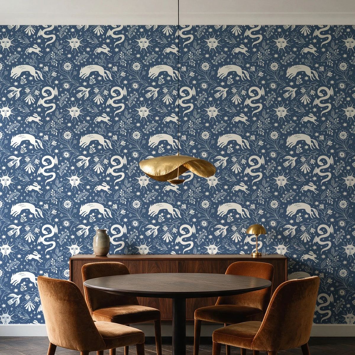 Sun & Moon Slate celestial folk wallpaper behind a walnut credenza and round table in an elegant dining room