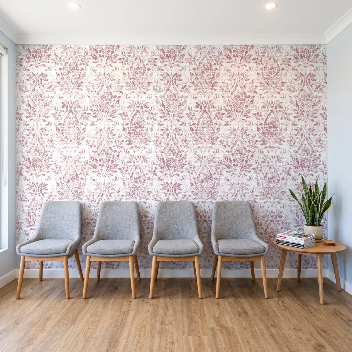 Tranquil Flora Rose floral damask wallpaper behind a row of upholstered chairs in a bright clinic waiting room