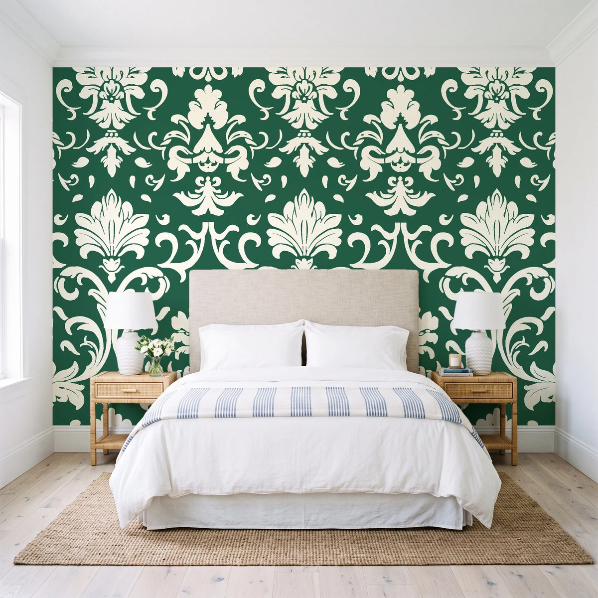 Twilight Garden Veil Emerald damask wallpaper behind a queen bed in a bright coastal bedroom