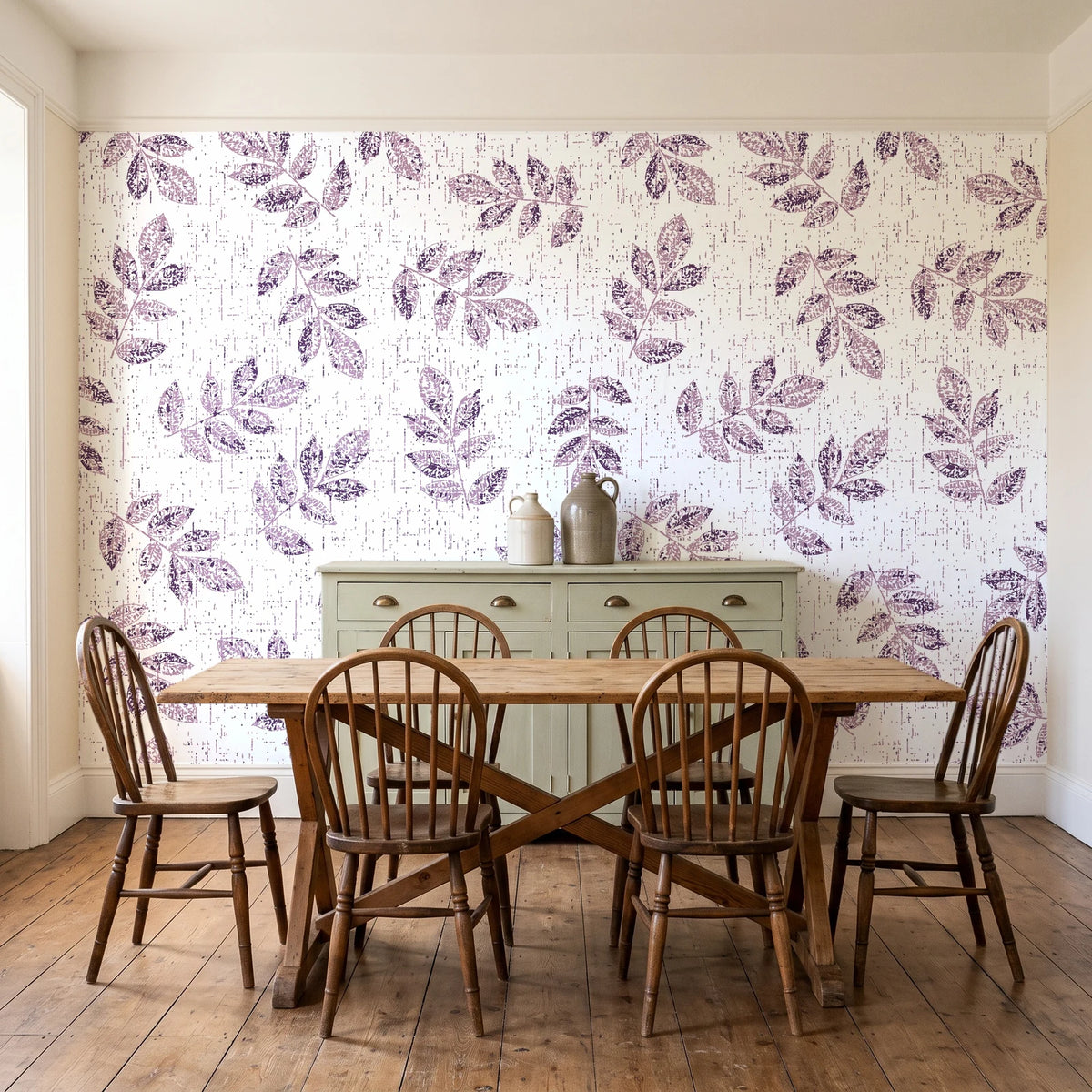 Verdant Scatter Plum tossed leaf wallpaper in a farmhouse dining room with a sage sideboard and rustic trestle table