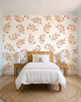 Verdant Scatter Terracotta tossed leaf wallpaper in a bright, cheerful child's bedroom