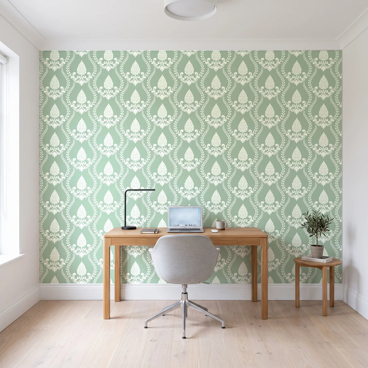 Victorian Vineage Celadon vine damask wallpaper behind a modern oak desk in a bright home office