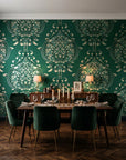 Vintage Eden Emerald damask wallpaper in a dark moody dining room with a candlelit table