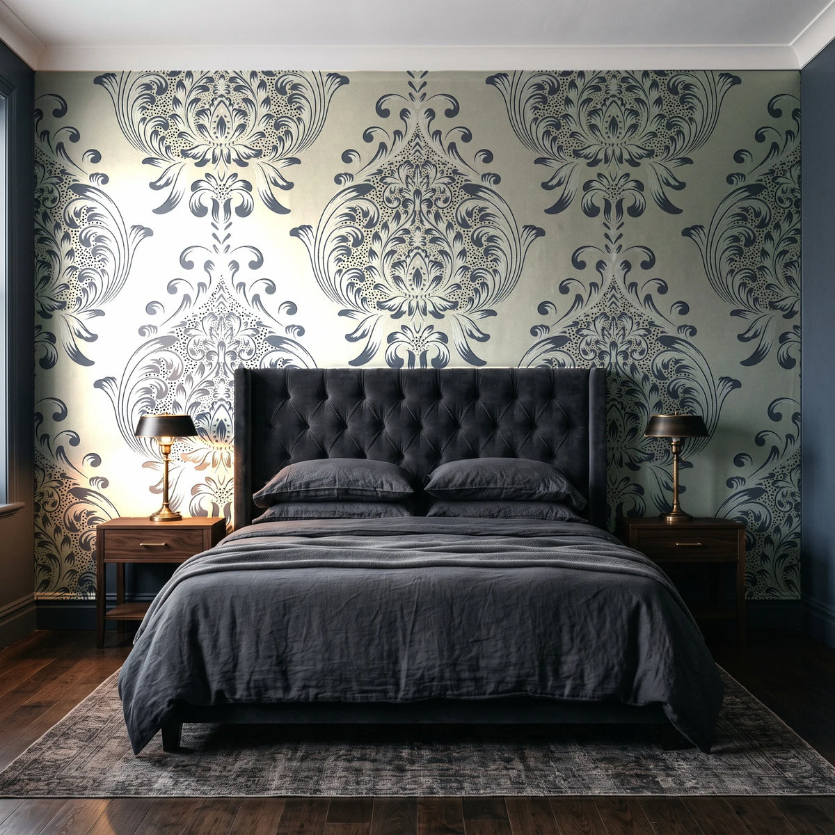 Vintage Eden Ink damask wallpaper behind a tufted headboard in a dark, moody bedroom