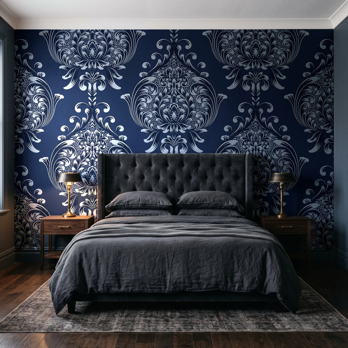 Vintage Eden Midnight damask wallpaper behind a tufted headboard in a dark, moody bedroom