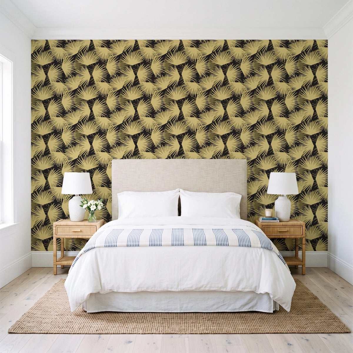 Wild Palm Ebony palm wallpaper behind a queen bed in a bright coastal bedroom