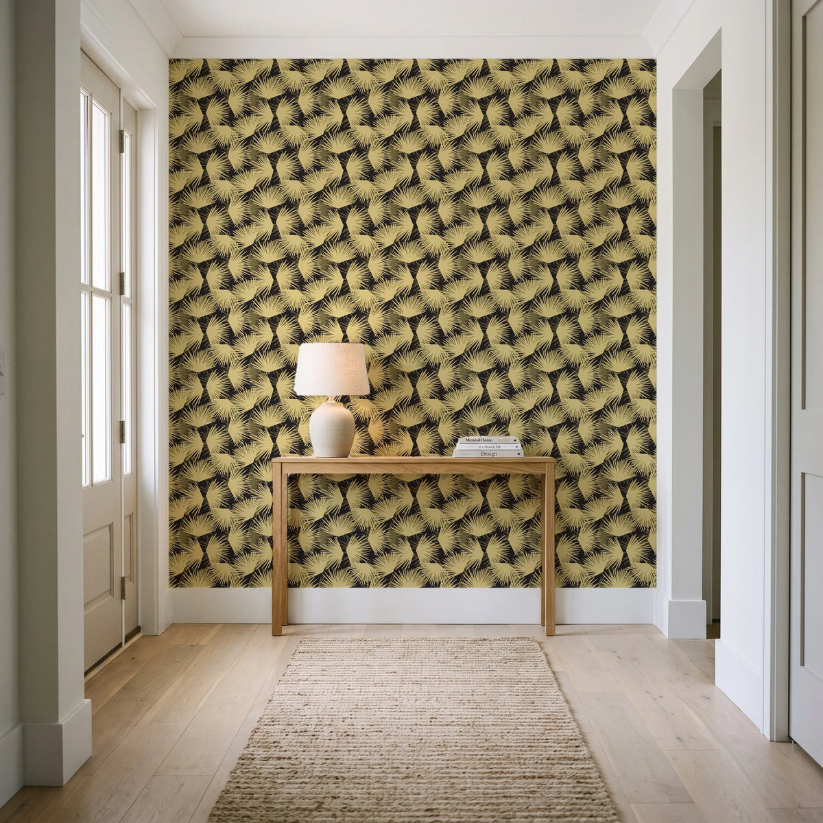 Wild Palm Ebony palm wallpaper behind a console table in a light entry hallway