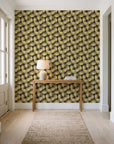 Wild Palm Ebony palm wallpaper behind a console table in a light entry hallway