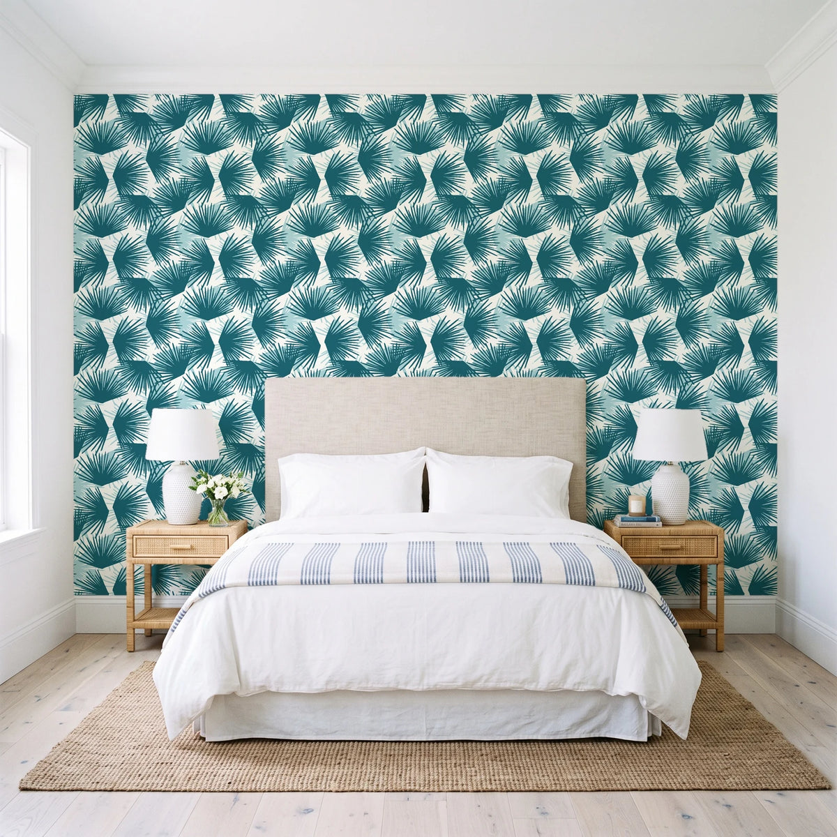 Wild Palm Lagoon palm wallpaper behind a queen bed in a bright coastal bedroom