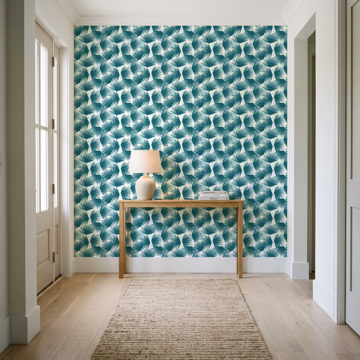 Wild Palm Lagoon palm wallpaper behind a console table in a light entry hallway