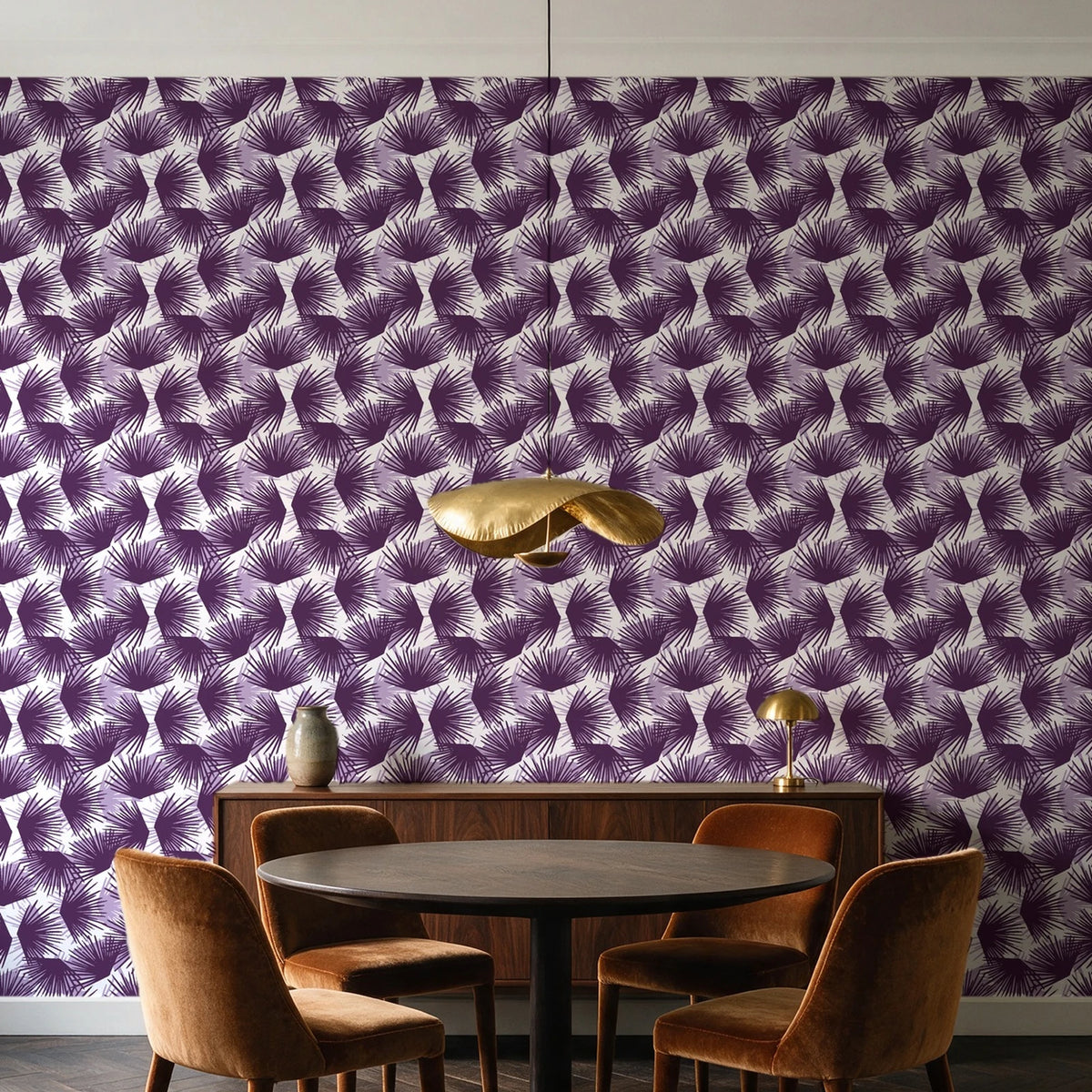 Wild Palm Plum palm wallpaper behind a walnut credenza and round table in an elegant dining room