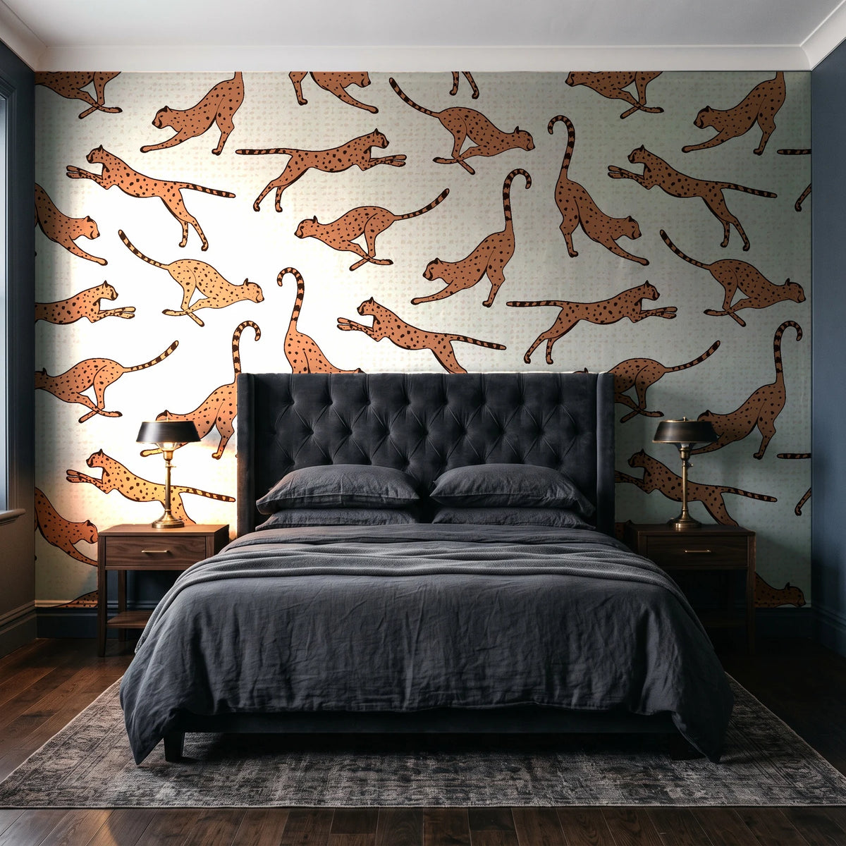 Wild Stride Terracotta cheetah wallpaper behind a tufted headboard in a dark, moody bedroom