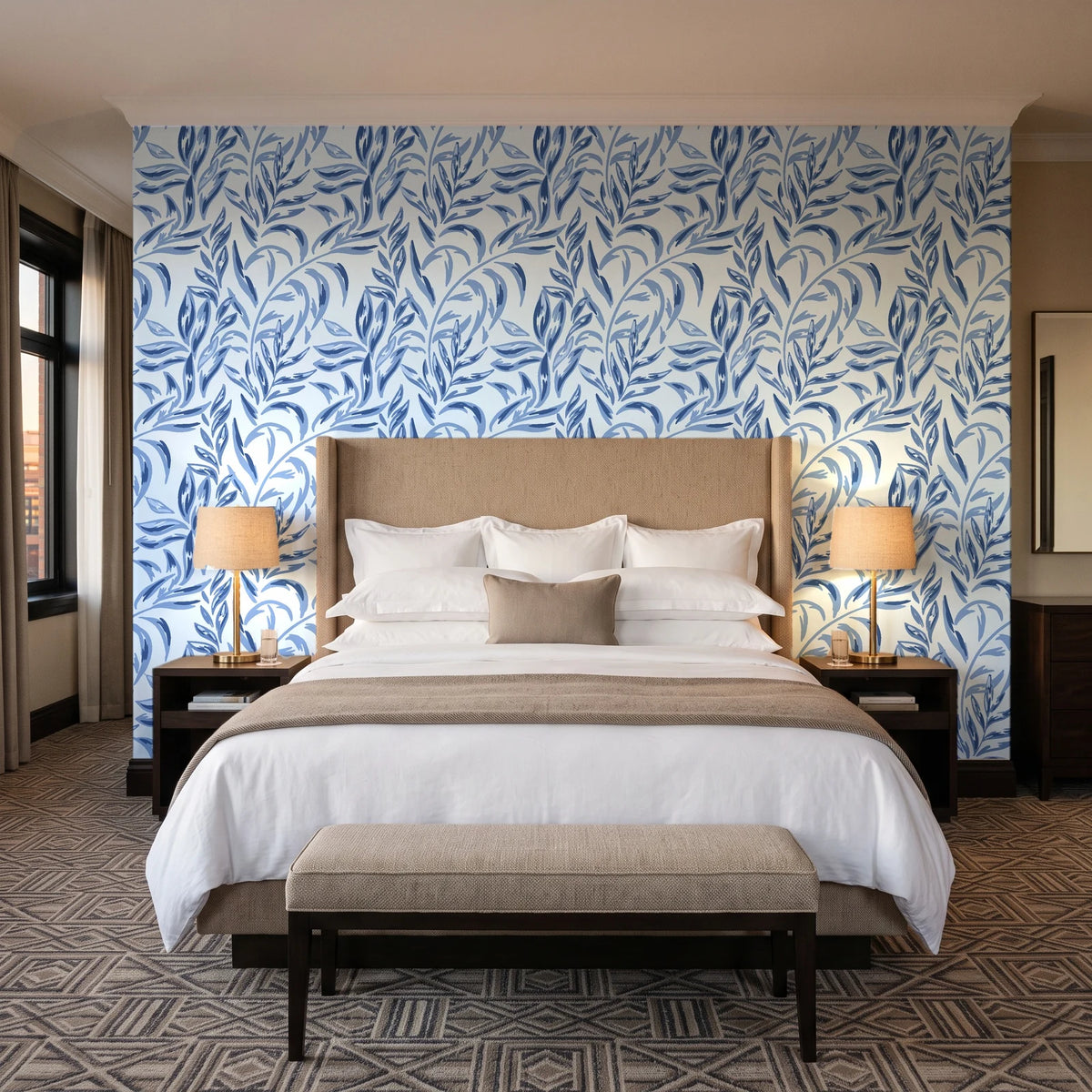 Willow Trace Indigo willow vine wallpaper behind the headboard of a king bed in a contemporary hotel guest room