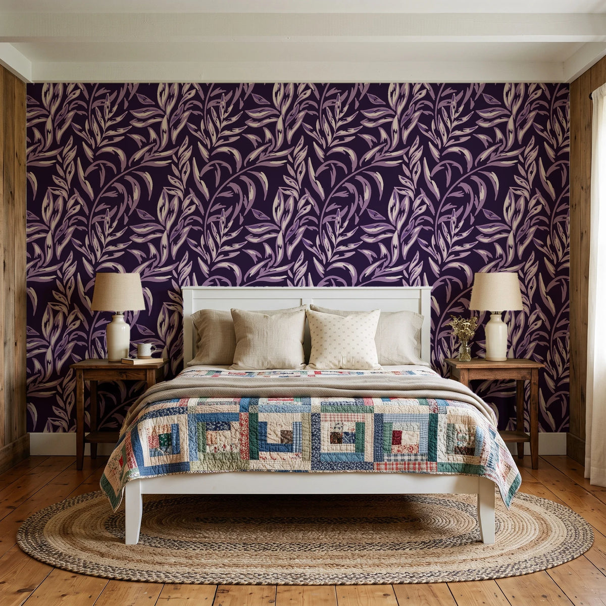 Willow Trace Plum willow vine wallpaper behind a white cottage bed with a patchwork quilt in a cozy cottagecore bedroom