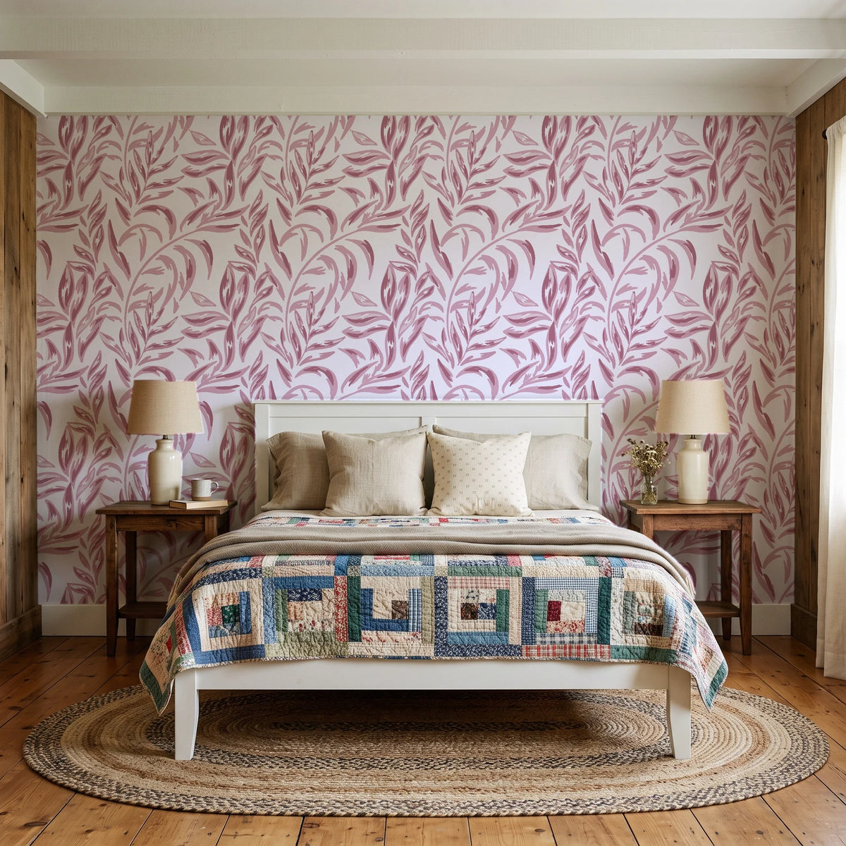 Willow Trace Rose willow vine wallpaper behind a white cottage bed with a patchwork quilt in a cozy cottagecore bedroom