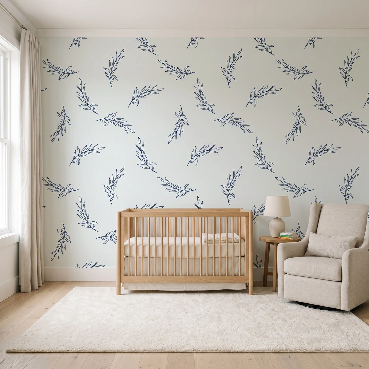 Willow Whisper Navy willow sprig wallpaper in a calm, light-filled nursery